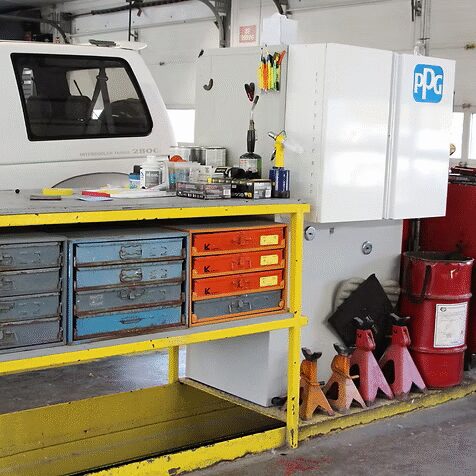 A shelf with items on it. A counter in front.