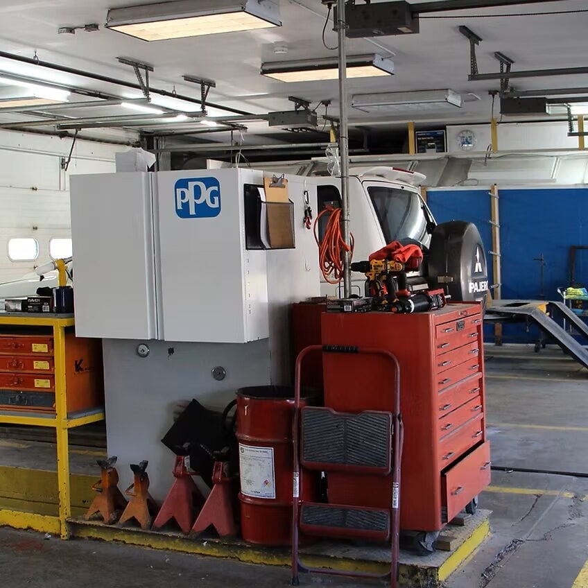 Large industrial machine with a red base and gray top